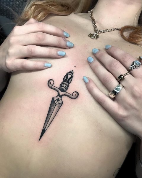 Black-dagger-tattoo-on-the-sternum.jpg