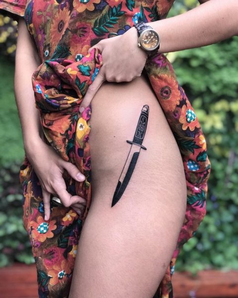 Black-knife-tattoo-on-the-hip.jpg